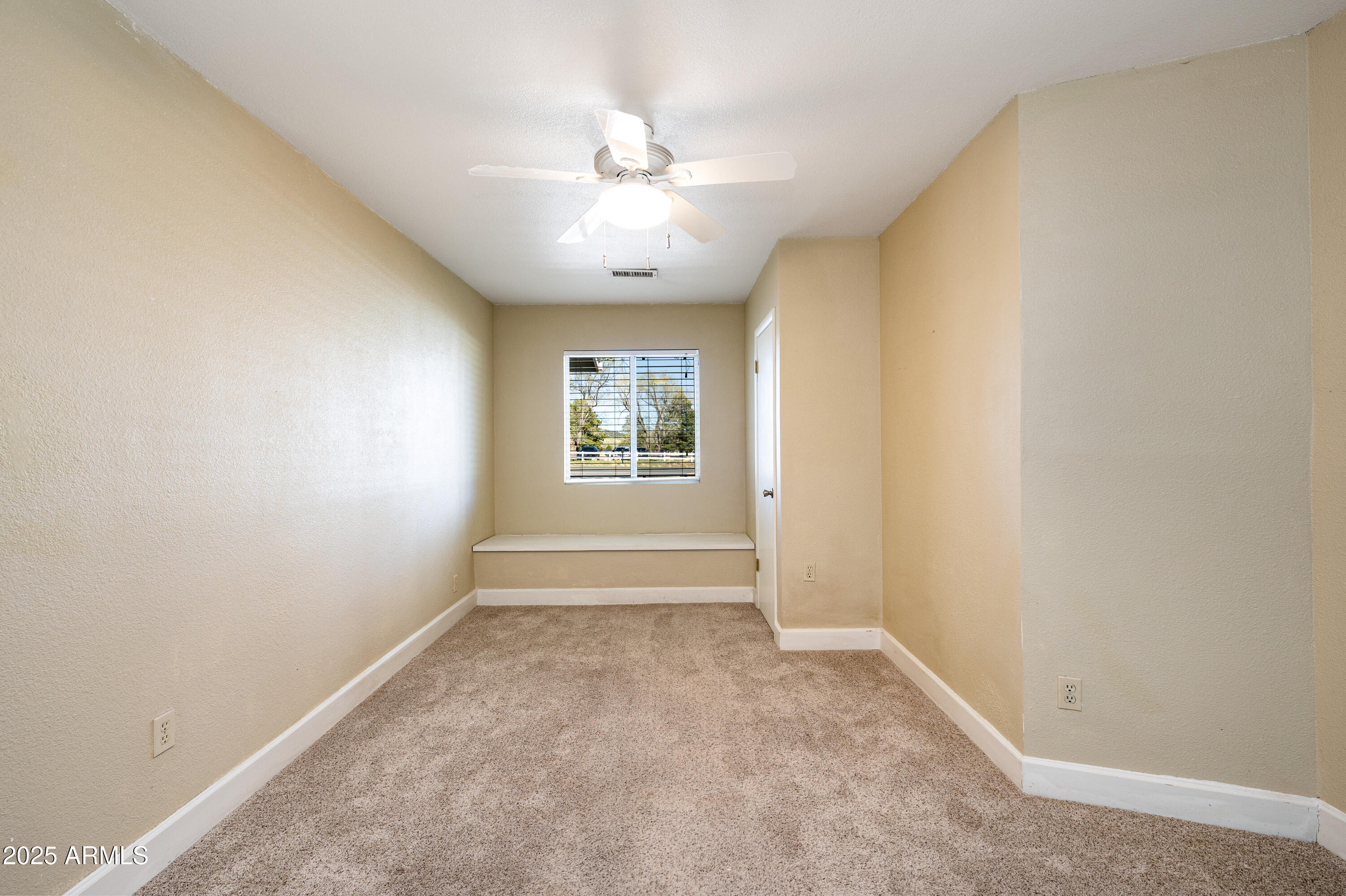8230 Koch Field Road Flagstaff, AZ 86004 - Photo 41 of 69 an empty room with windows and fan