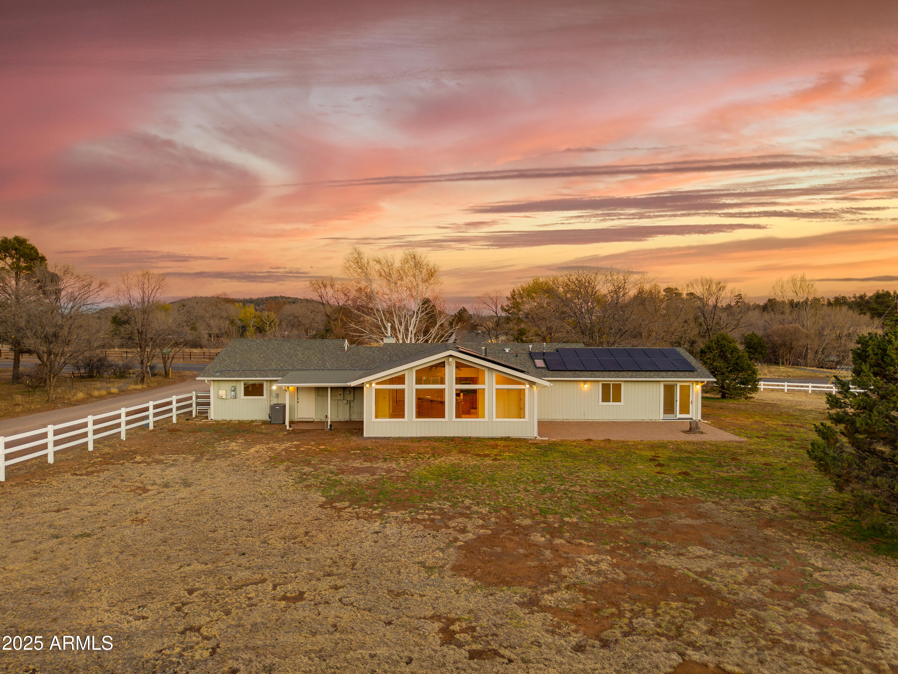 8230 Koch Field Road Flagstaff, AZ 86004 - Photo 42 of 69 a view of house with yard and mountain in the background