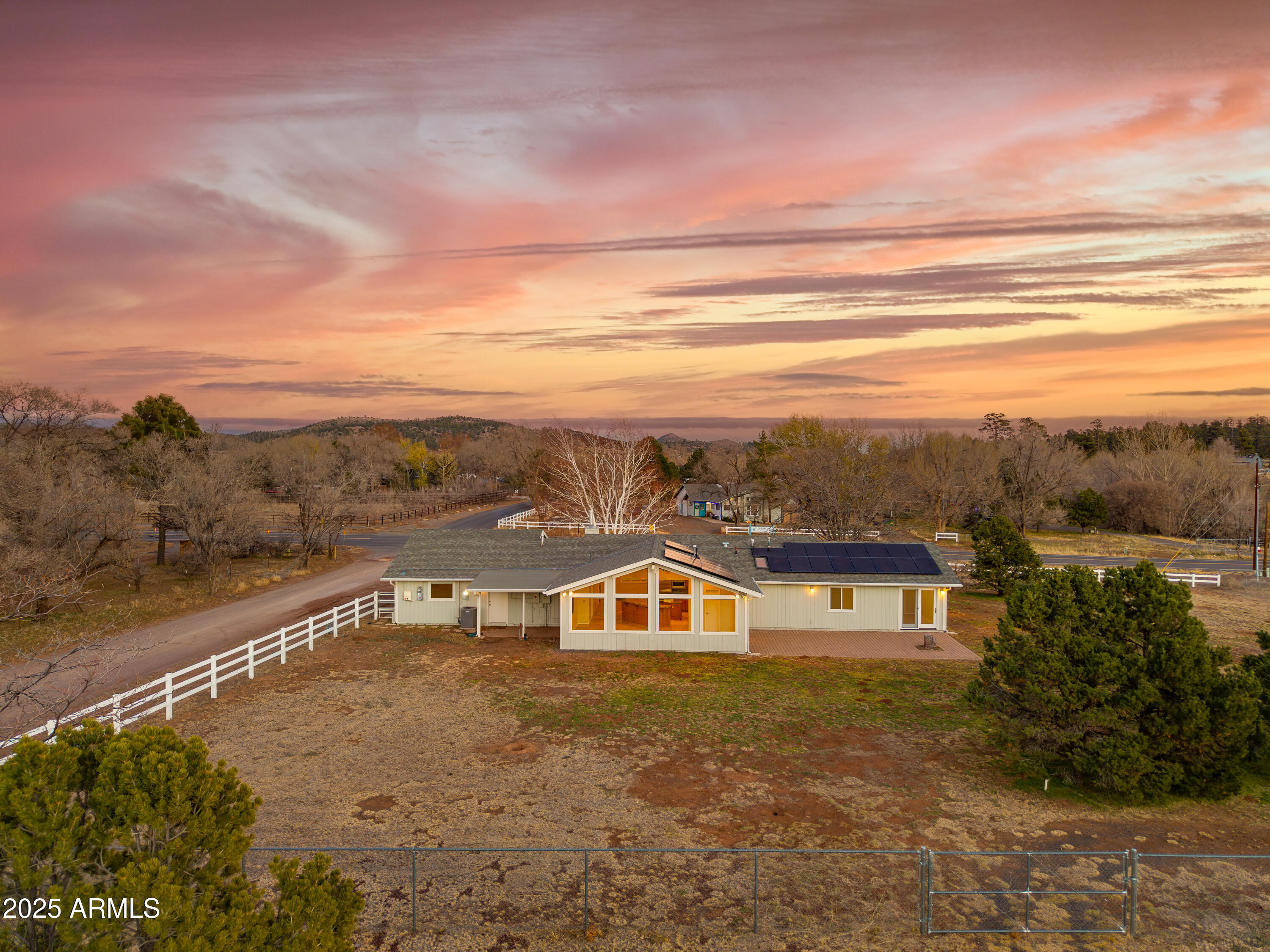8230 Koch Field Road Flagstaff, AZ 86004 - Photo 46 of 69 a view of a big house with a mountain in the background