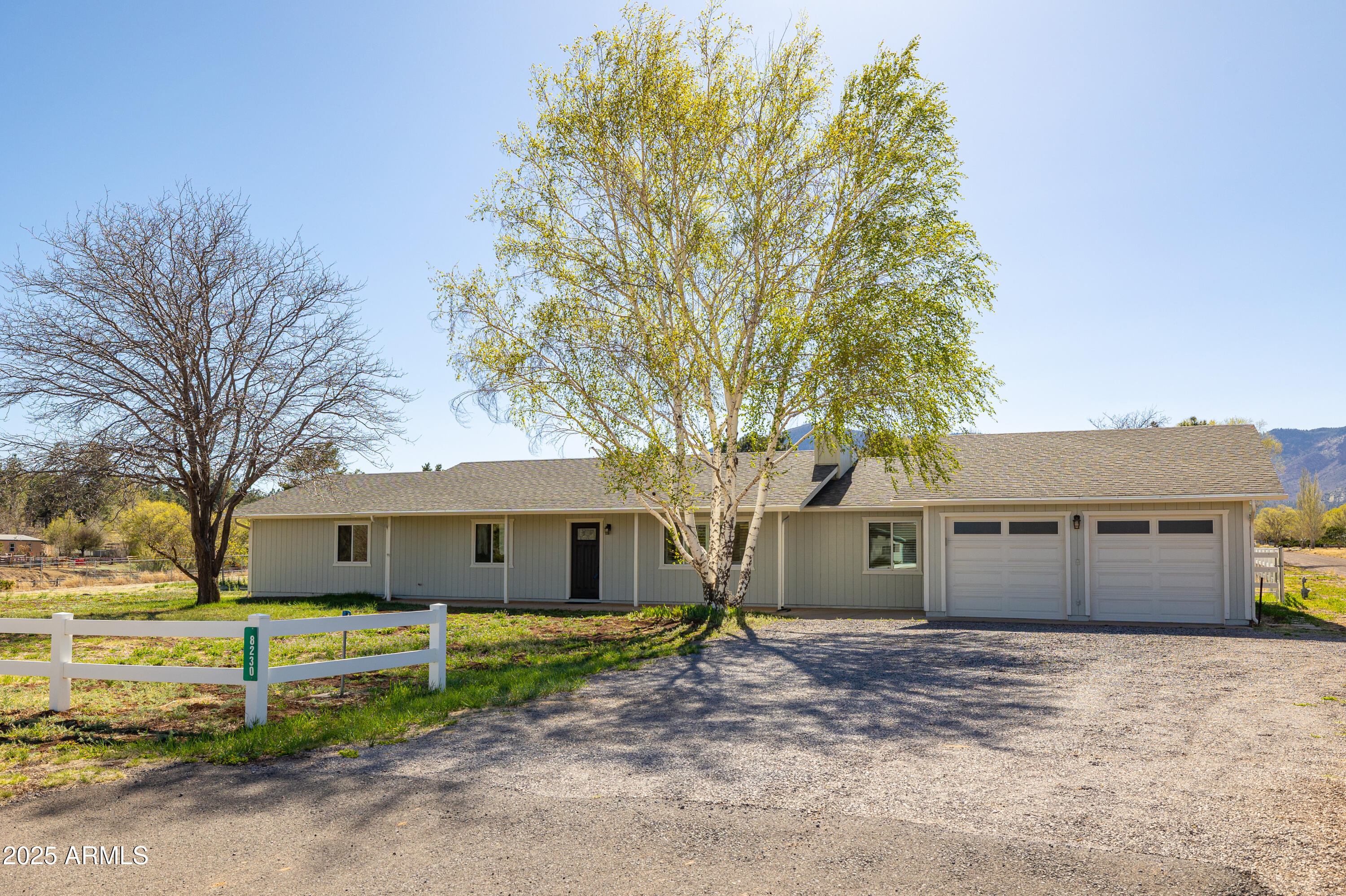 8230 Koch Field Road Flagstaff, AZ 86004 - Photo 5 of 69 a front view of a house with a garden and trees