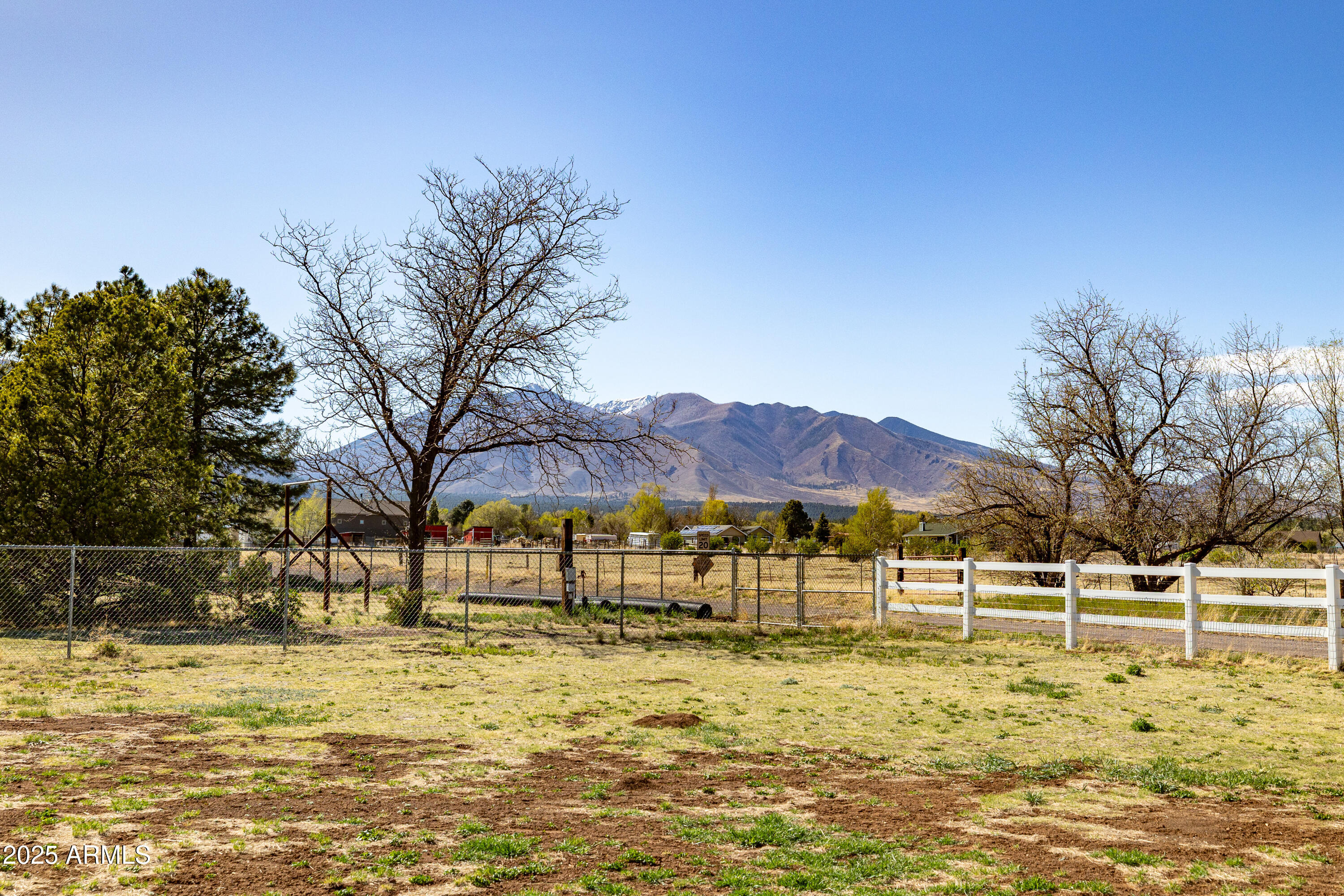 8230 Koch Field Road Flagstaff, AZ 86004 - Photo 55 of 69 a view of swimming pool with a lawn chairs under an umbrella