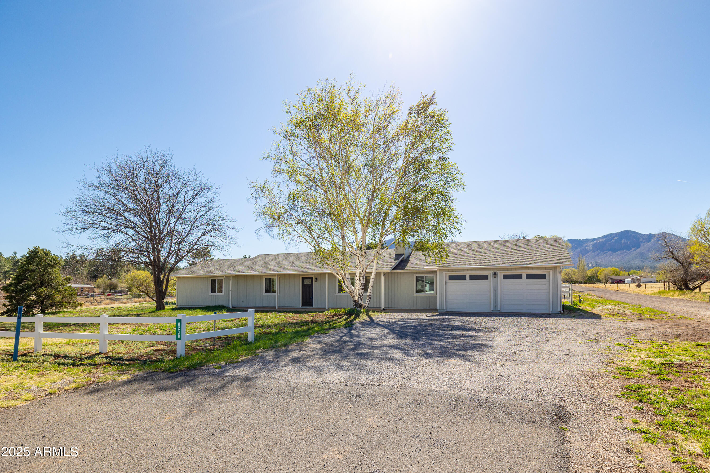8230 Koch Field Road Flagstaff, AZ 86004 - Photo 60 of 69 a front view of a house with a garden and mountain view