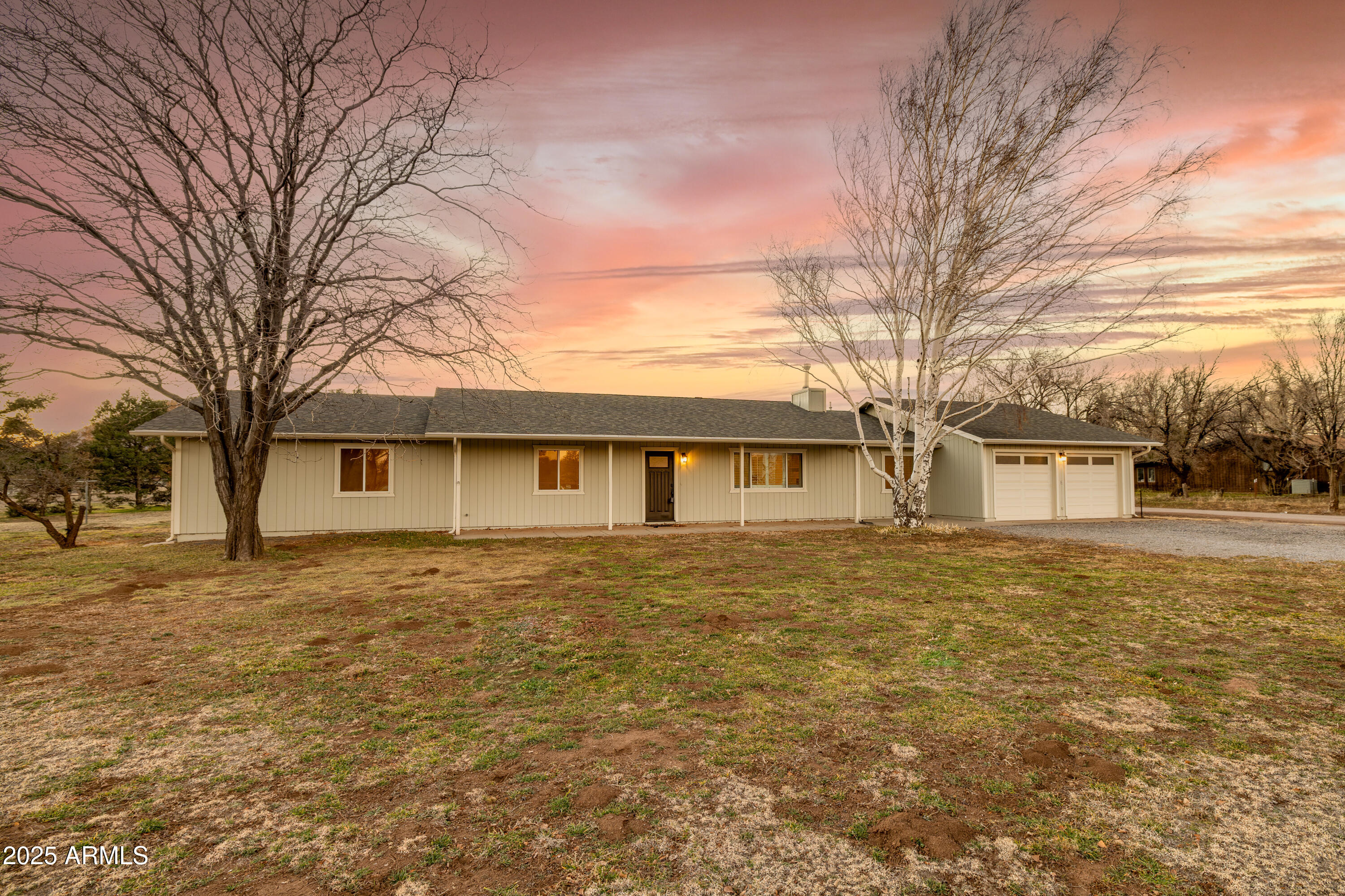 8230 Koch Field Road Flagstaff, AZ 86004 - Photo 63 of 69 a front view of a house with a yard covered with trees