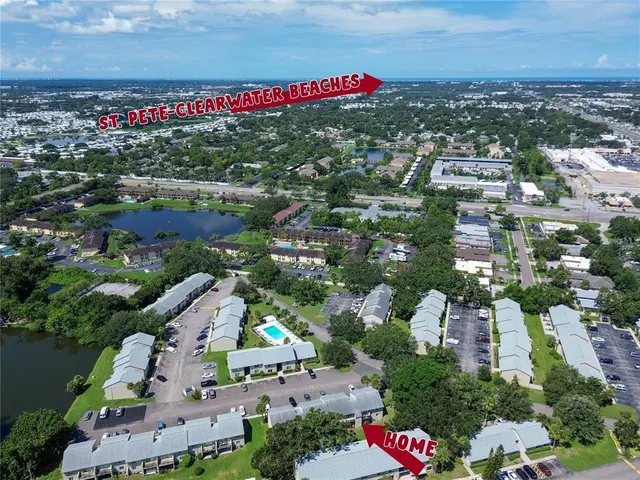 an aerial view of a houses with city street