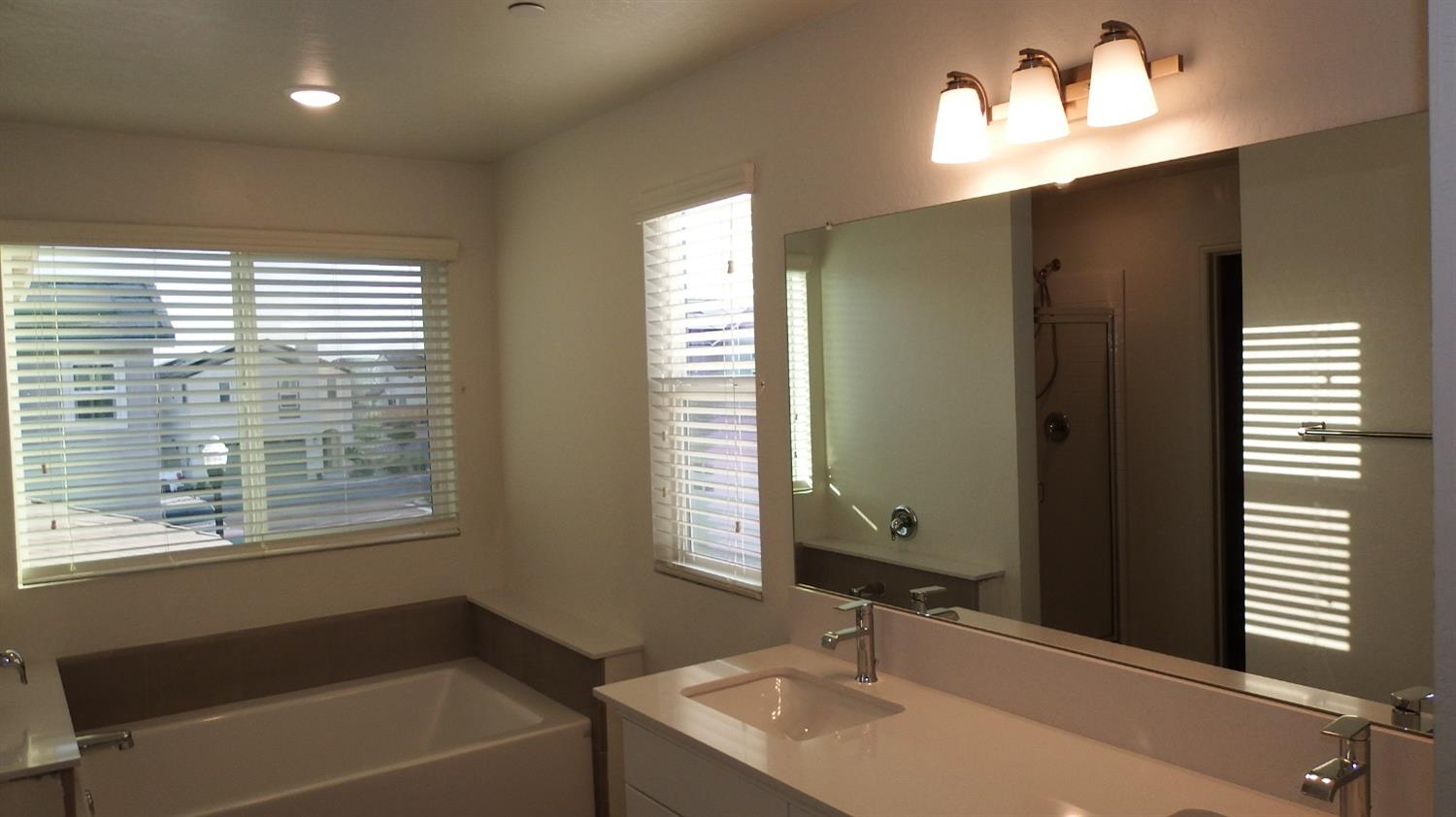 2008 North Walling Lane Clovis, CA 93619 - Photo 5 of 12 a bathroom with a sink and a bathtub