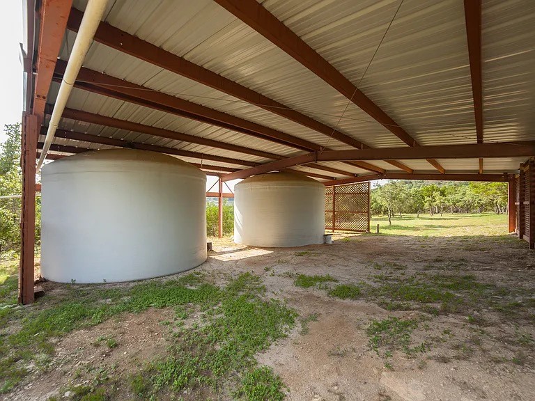 9763 Ranch Road 1623 Blanco, TX 78606 - Photo 40 of 40 In addition to a well, they also have 2 10,000 gal rainwater tanks which the house runs completely off of