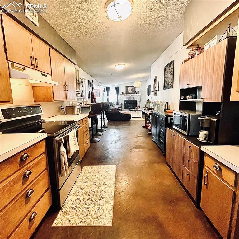 8715 Chipita Park Road Cascade, CO 80809 - Photo 17 of 25 a kitchen with lots of counter top space