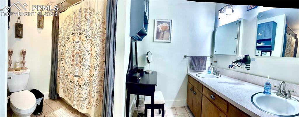 8715 Chipita Park Road Cascade, CO 80809 - Photo 20 of 25 a bathroom with a sink toilet and shower