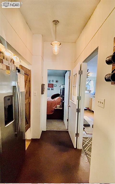 8715 Chipita Park Road Cascade, CO 80809 - Photo 25 of 25 a view of hallway with furniture and a refrigerator
