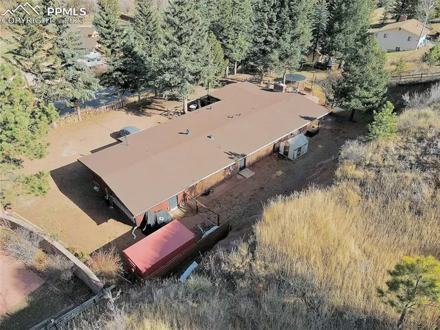 an aerial view of residential houses with outdoor space