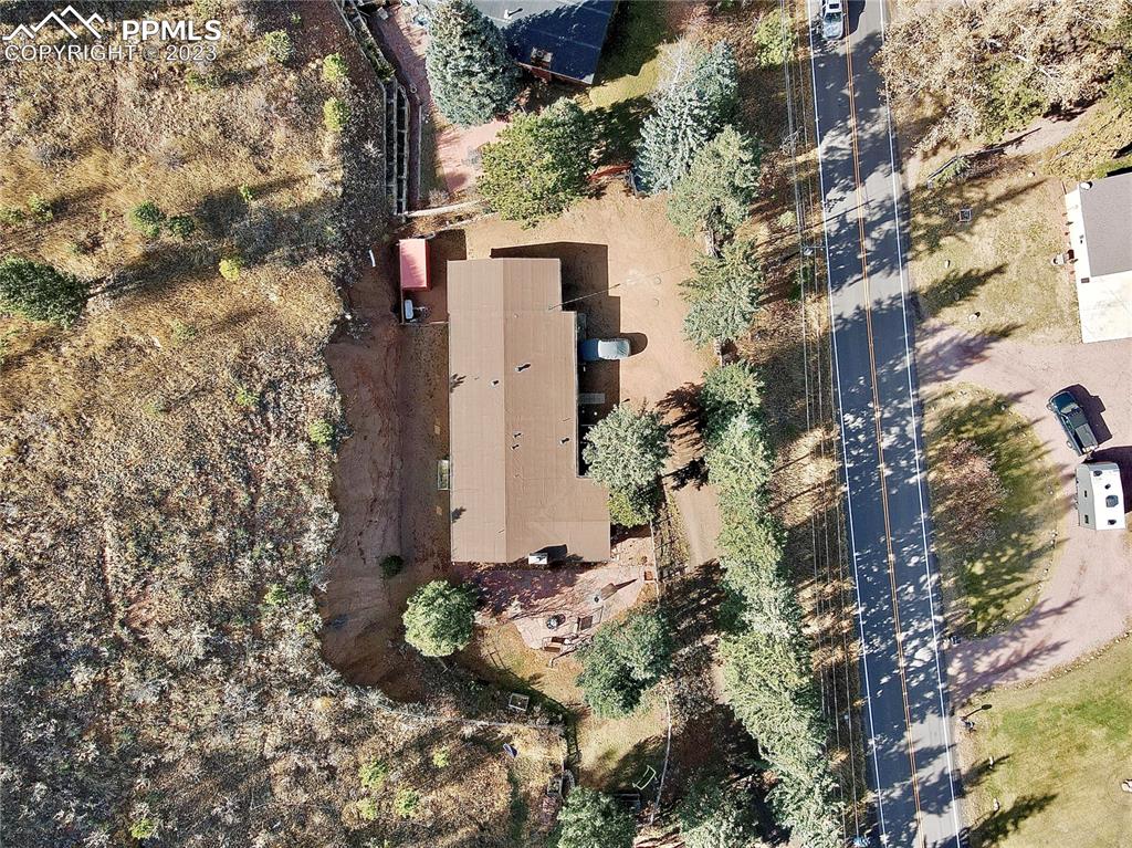8715 Chipita Park Road Cascade, CO 80809 - Photo 5 of 25 an aerial view of a house with a yard
