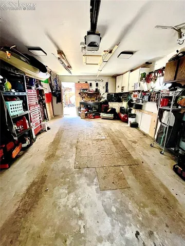 a view of parking garage with cars
