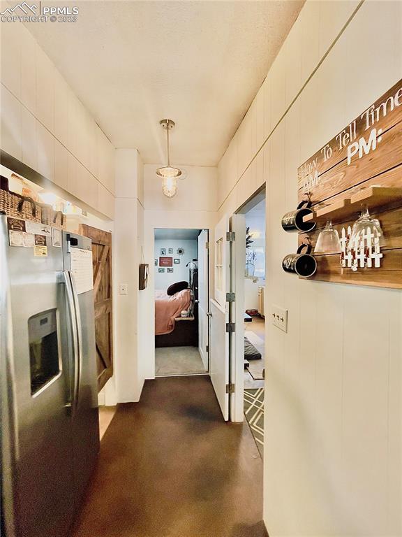 8715 Chipita Park Road Cascade, CO 80809 - Photo 10 of 25 a view of a livingroom with furniture and a fireplace