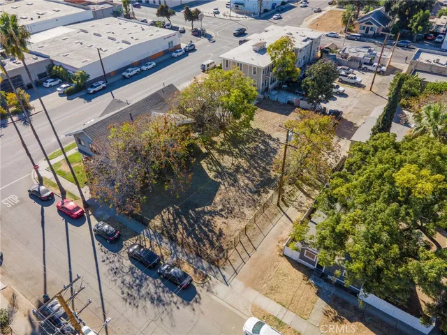 an aerial view of a house with a yard
