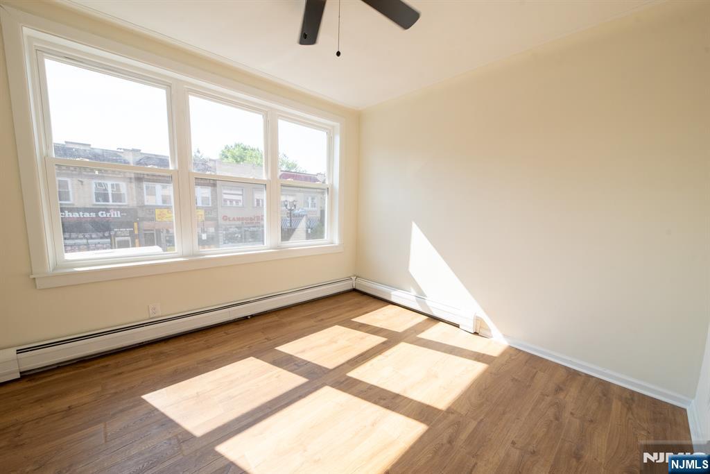 7723 Bergenline Avenue, Unit 3 North Bergen, NJ 07047 - Photo 6 of 12 a view of an empty room and window