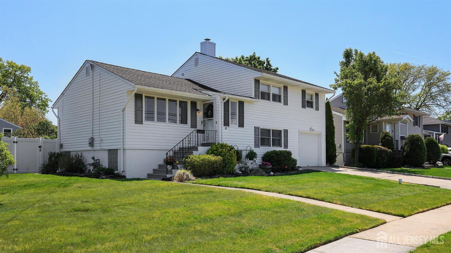 47 Miliken Road Colonia, NJ 07067 - Photo 3 of 40 a front view of a house with a yard