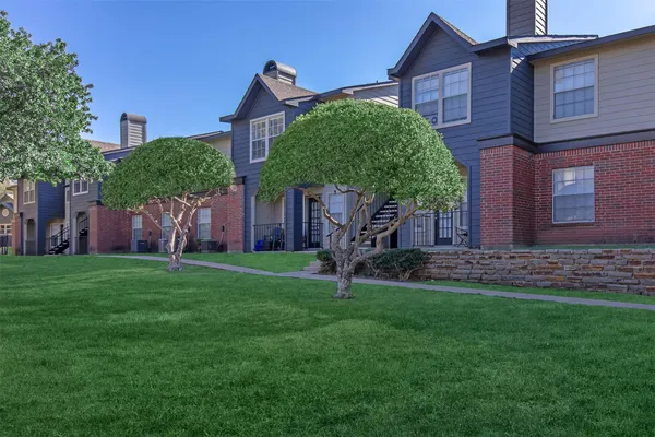 a house view with a garden space