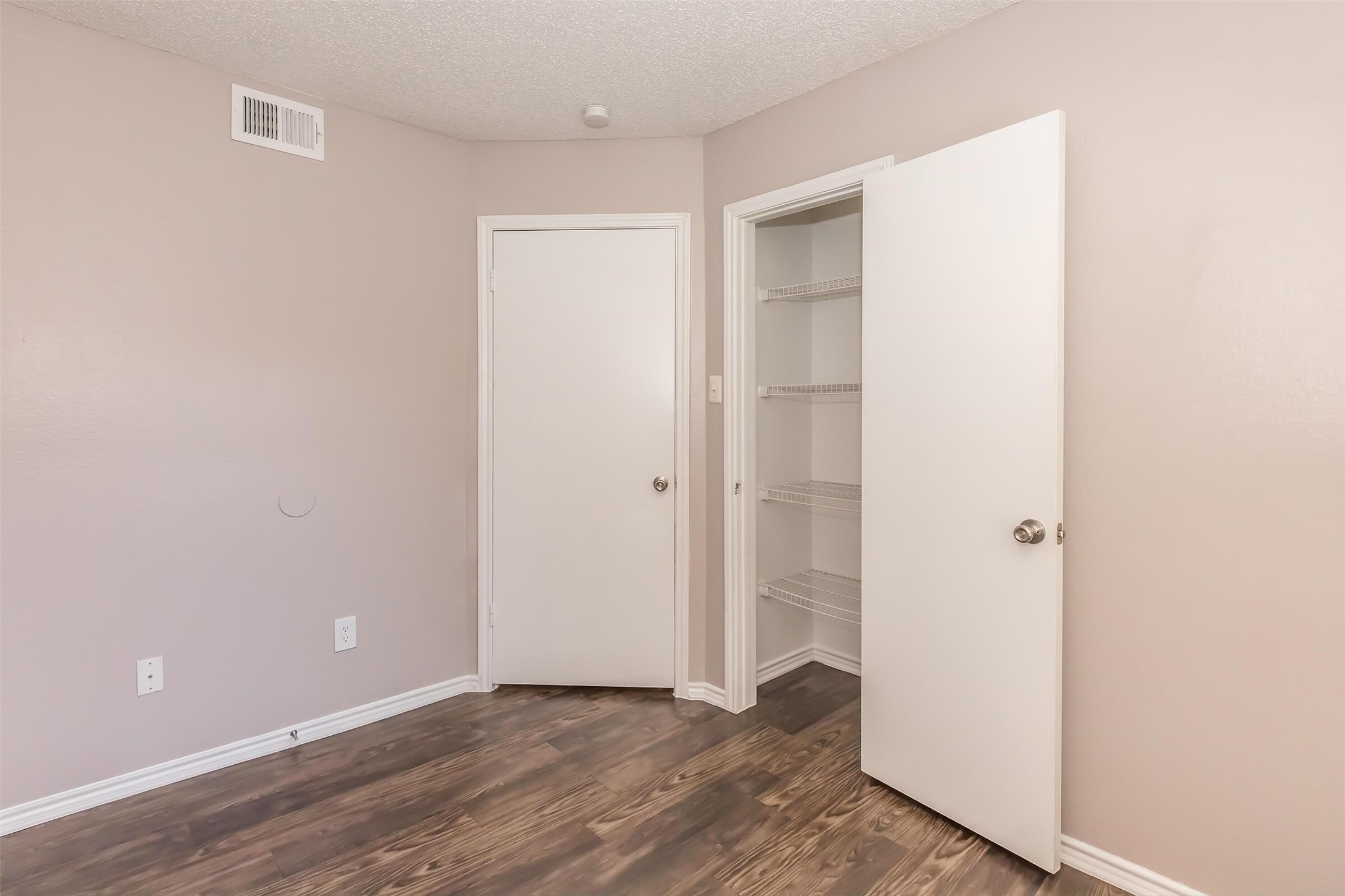 8301 Boat Club Road, Unit 415 Fort Worth, TX 76179 - Photo 9 of 45 a view of an empty room with wooden floor