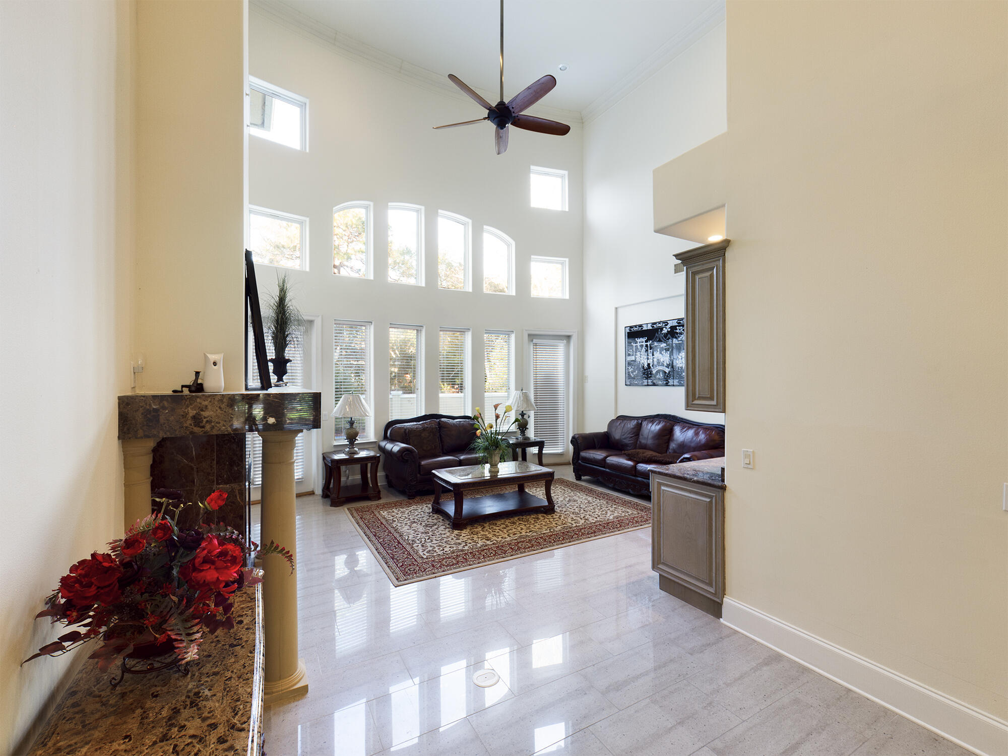 263 Leaning Pines Loop Destin, FL 32541 - Photo 11 of 58 a living room with furniture a chandelier and a large window