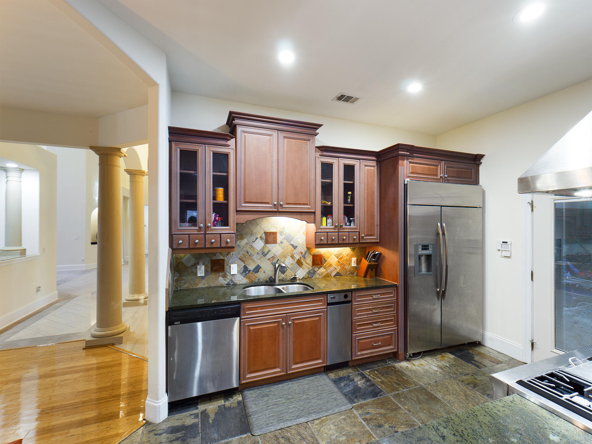 263 Leaning Pines Loop Destin, FL 32541 - Photo 19 of 58 a kitchen with stainless steel appliances granite countertop a refrigerator and stove