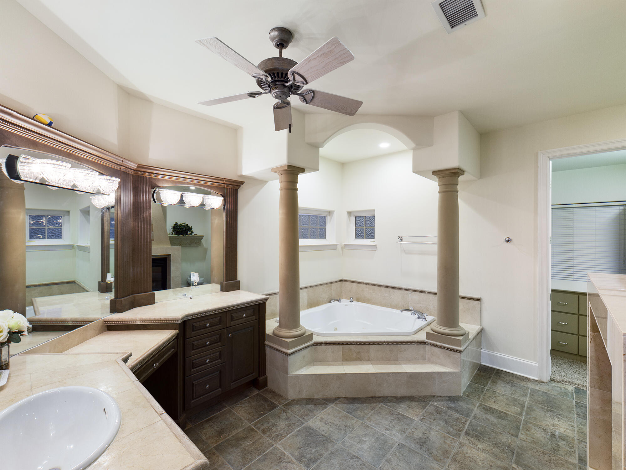 263 Leaning Pines Loop Destin, FL 32541 - Photo 31 of 58 a spacious bathroom with a tub sink and a mirror