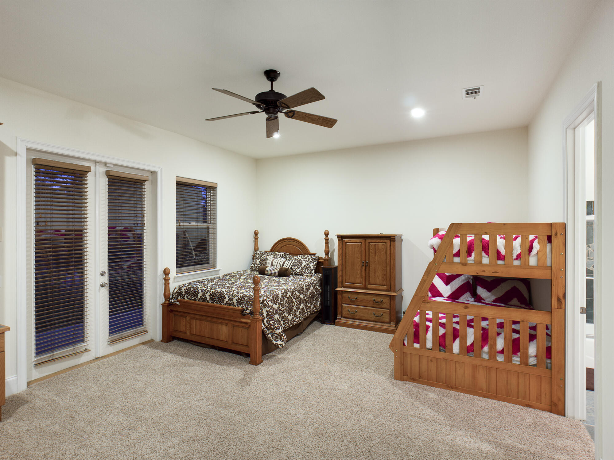 263 Leaning Pines Loop Destin, FL 32541 - Photo 36 of 58 a bedroom with a bed and a chandelier