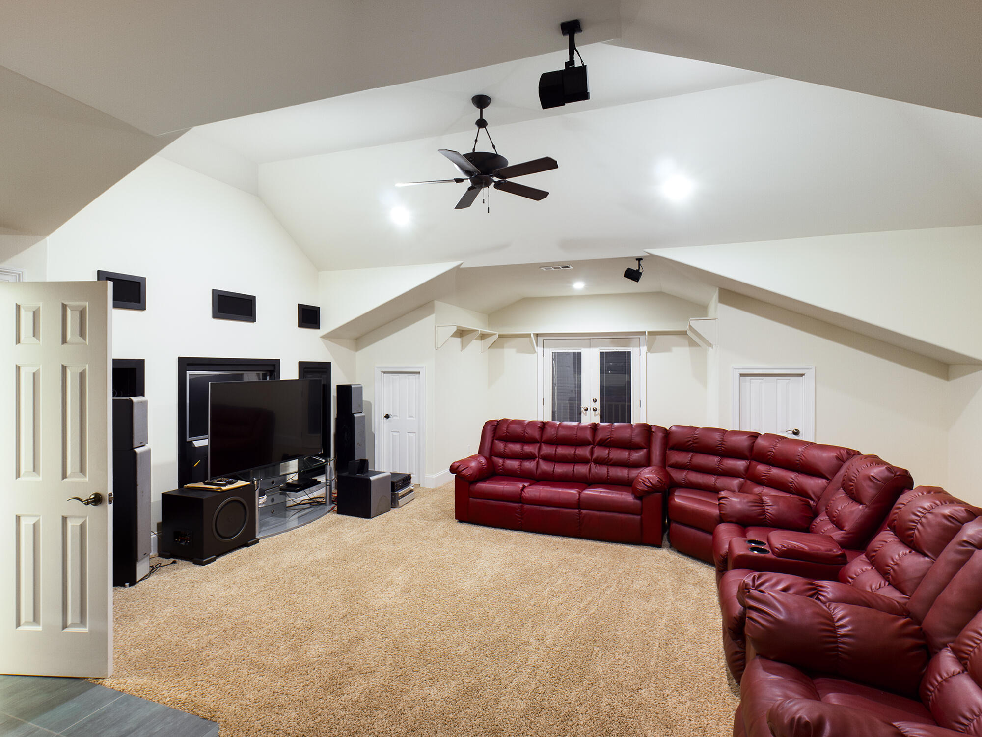 263 Leaning Pines Loop Destin, FL 32541 - Photo 42 of 58 a living room with furniture a ceiling fan and a flat screen tv