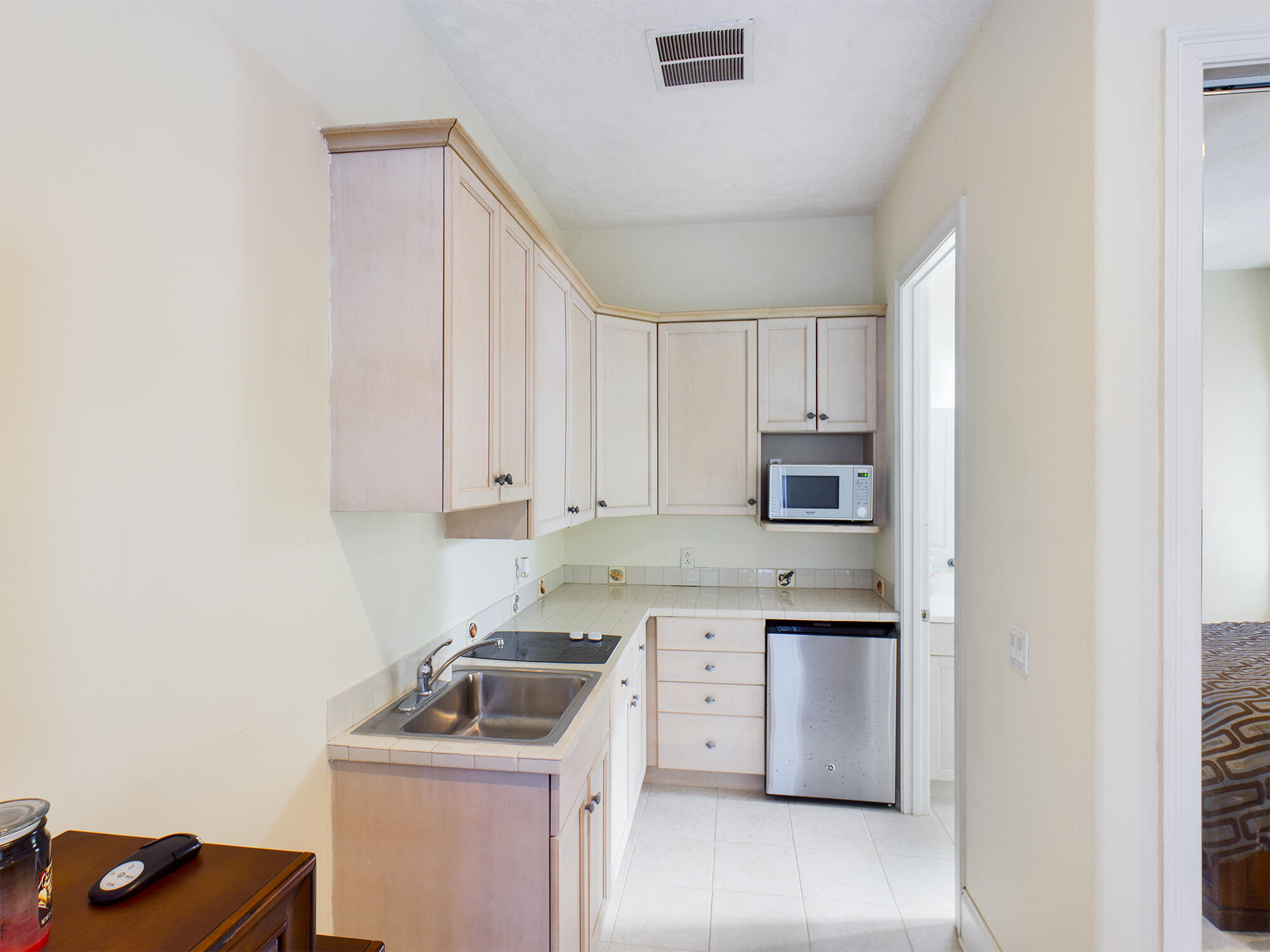 263 Leaning Pines Loop Destin, FL 32541 - Photo 47 of 58 a kitchen with a sink stove and cabinets