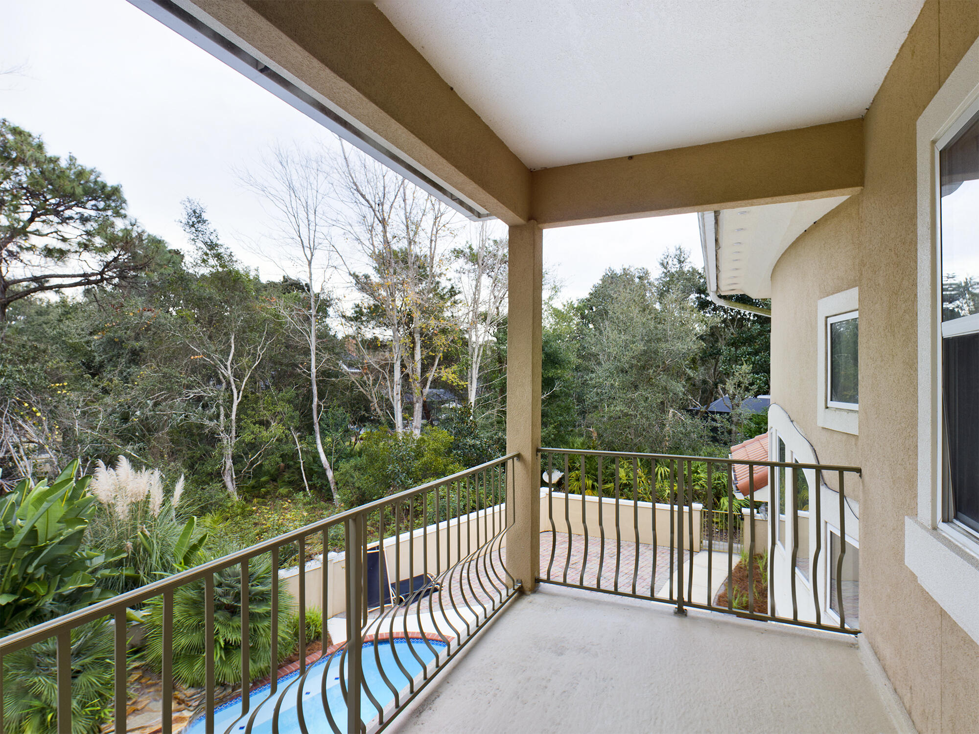 263 Leaning Pines Loop Destin, FL 32541 - Photo 56 of 58 a view of a balcony with floor to ceiling windows