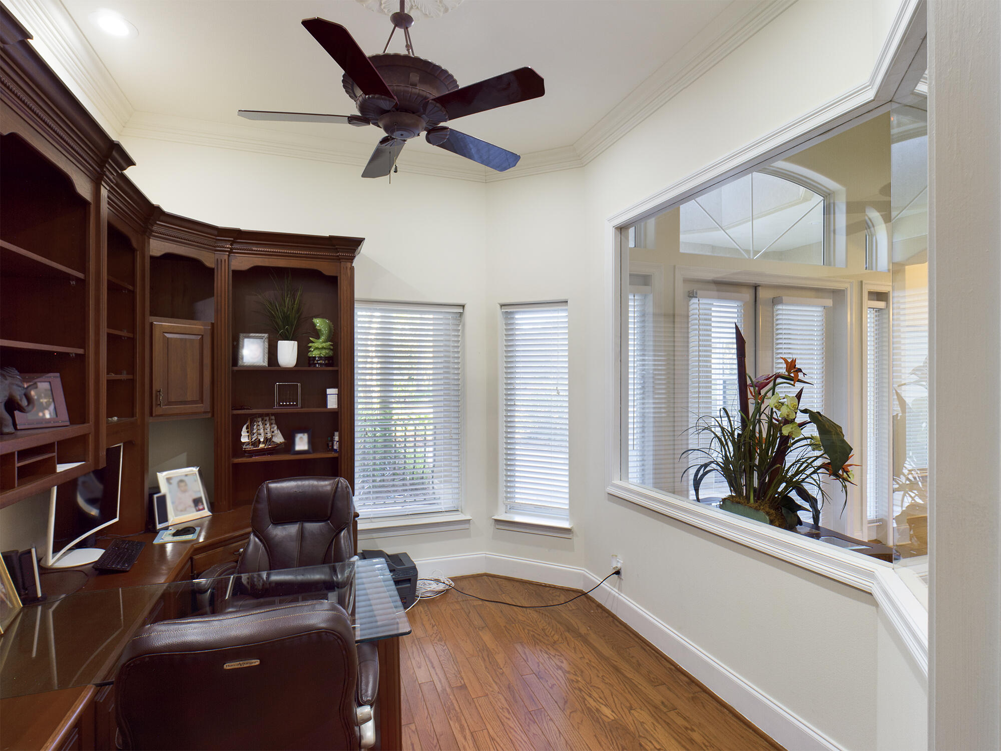 263 Leaning Pines Loop Destin, FL 32541 - Photo 57 of 58 a living room with furniture cabinets and a large window