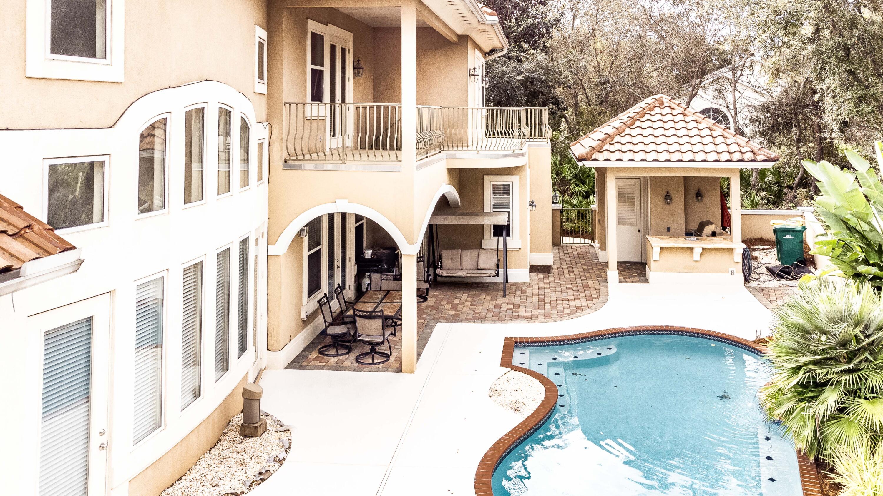 263 Leaning Pines Loop Destin, FL 32541 - Photo 6 of 58 a view of a patio with couches table and chairs and potted plants