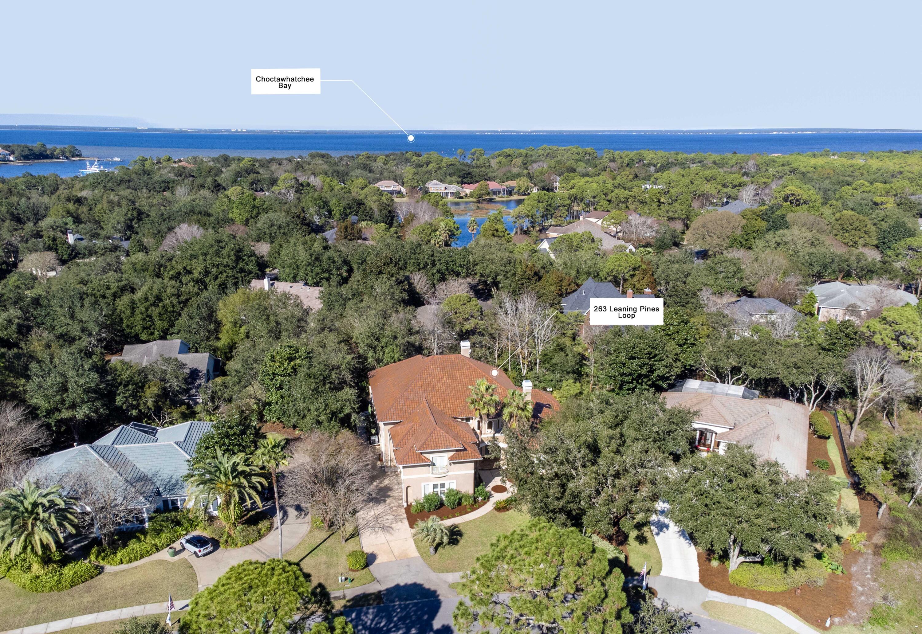 263 Leaning Pines Loop Destin, FL 32541 - Photo 7 of 58 an aerial view of a house with a yard and lake view