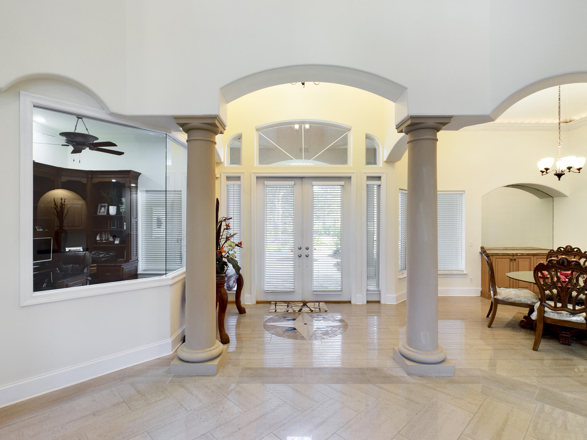 263 Leaning Pines Loop Destin, FL 32541 - Photo 8 of 58 a view of a room with wooden floor and windows