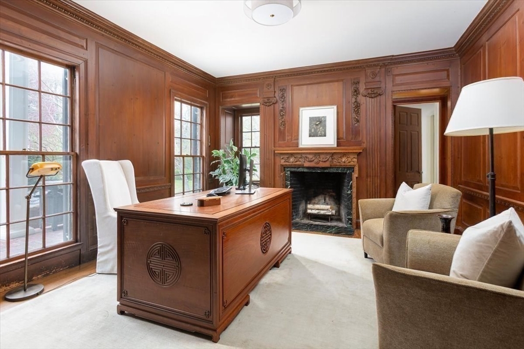 300 Warren Street Brookline, MA 02445 - Photo 11 of 35 a living room with furniture a flat screen tv and a fireplace