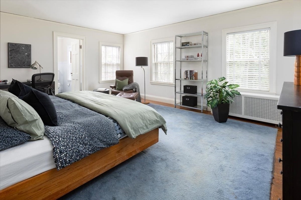 300 Warren Street Brookline, MA 02445 - Photo 22 of 35 a spacious bedroom with a bed and a couch