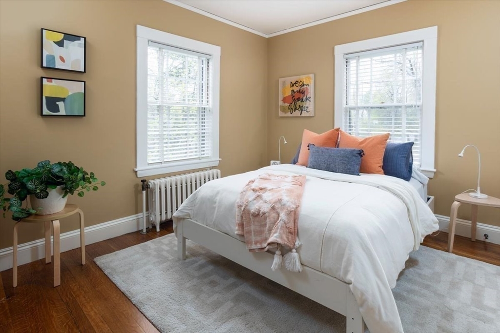 300 Warren Street Brookline, MA 02445 - Photo 25 of 35 a bed sitting in a bedroom next to a window