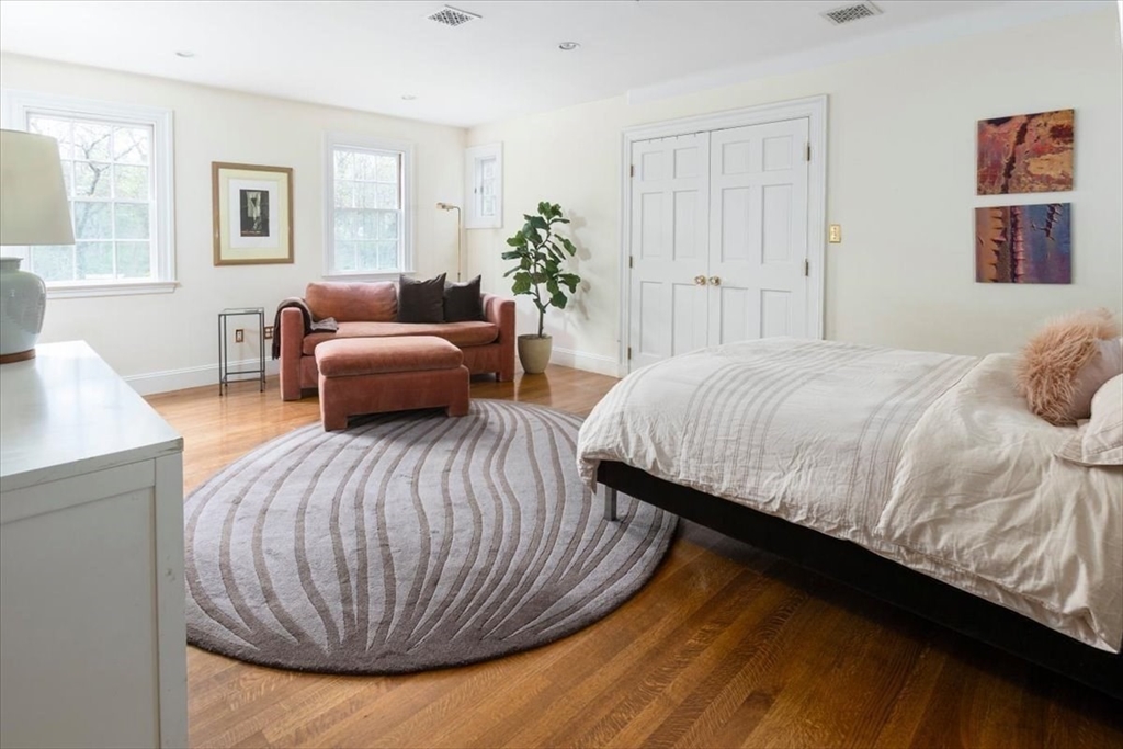 300 Warren Street Brookline, MA 02445 - Photo 27 of 35 a bedroom with a bed and window