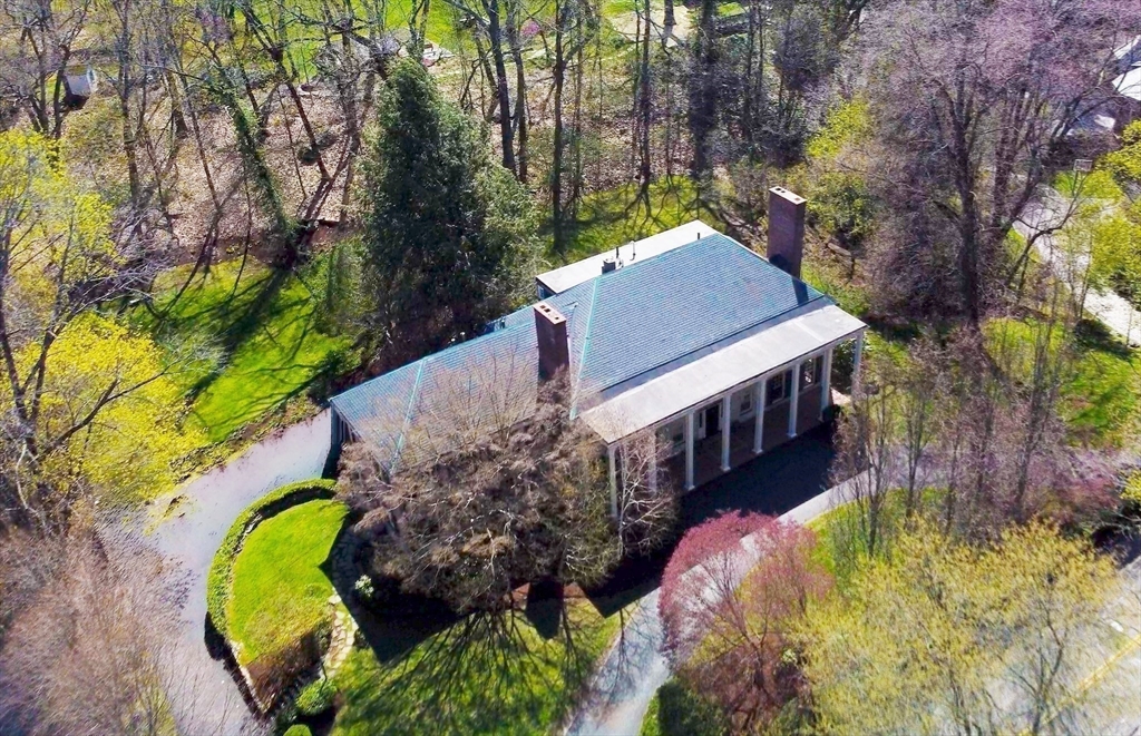 300 Warren Street Brookline, MA 02445 - Photo 35 of 35 a aerial view of a house with swimming pool and large trees