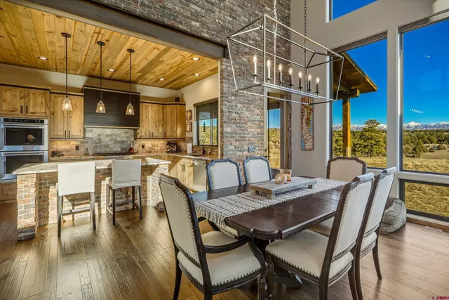 a view of a chairs and a table in the patio