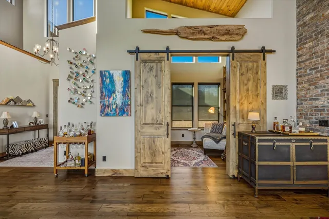 a view of living room with furniture and book shelf