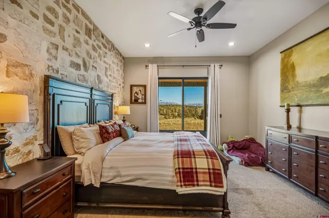 a view of walk in closet with clothes