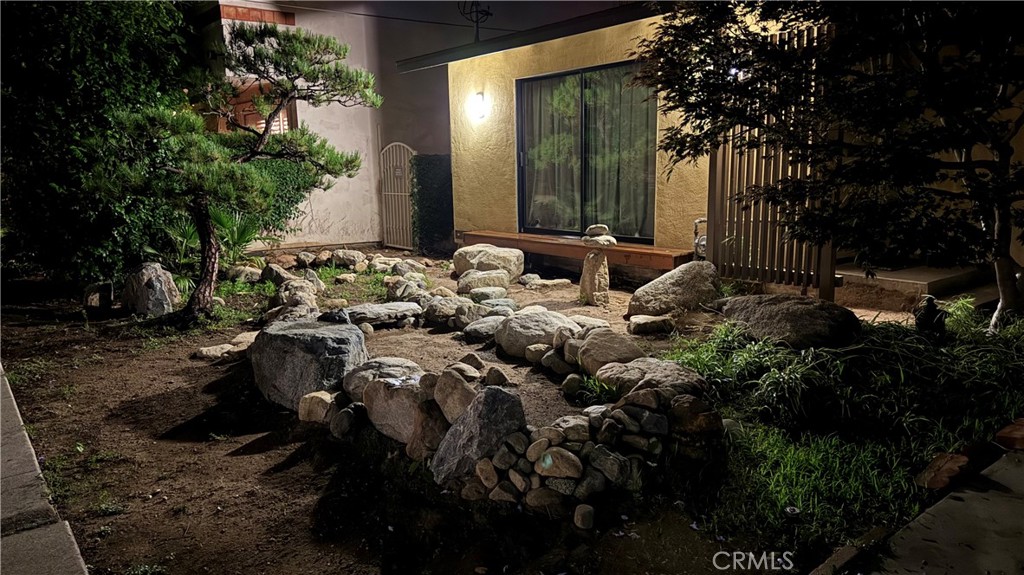 2117 Colby Avenue West Los Angeles, CA 90025 - Photo 21 of 43 a view of a house with a backyard and garden