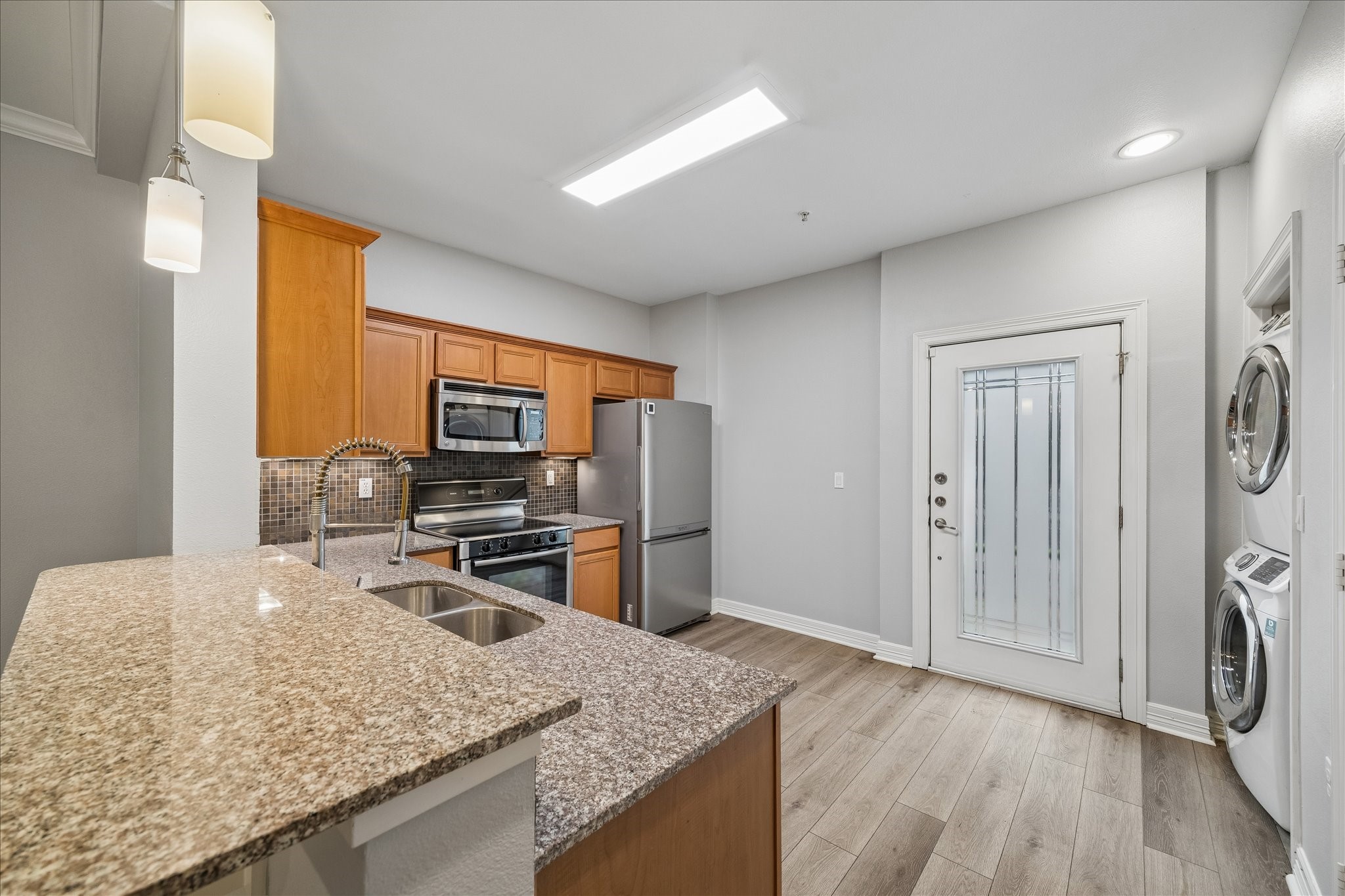 3501 Chenevert Street, Unit 7 Houston, TX 77004 - Photo 6 of 21 Kitchen with seamless access to the private yard and convenient street parking just outside.