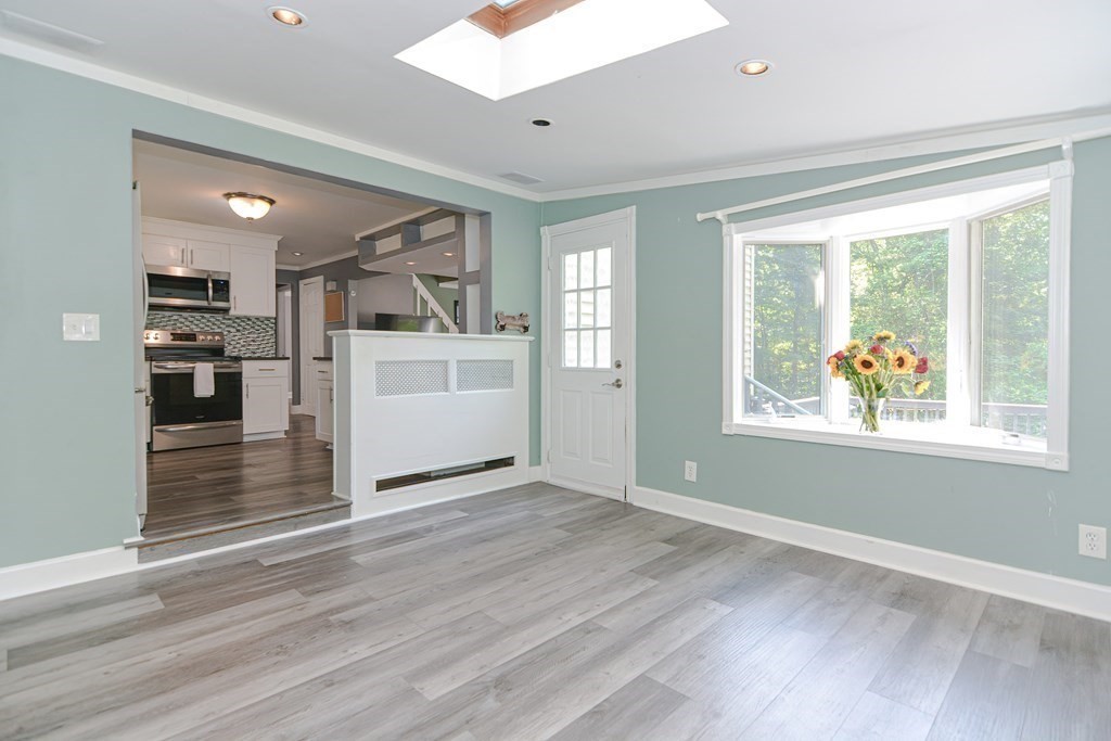 183 Brickel Road Stoughton, MA 02072 - Photo 15 of 38 a view of a kitchen with furniture wooden floor and window
