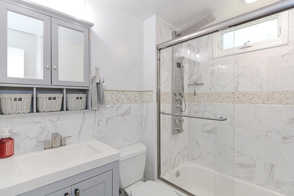 183 Brickel Road Stoughton, MA 02072 - Photo 16 of 38 a bathroom with a sink a toilet and shower