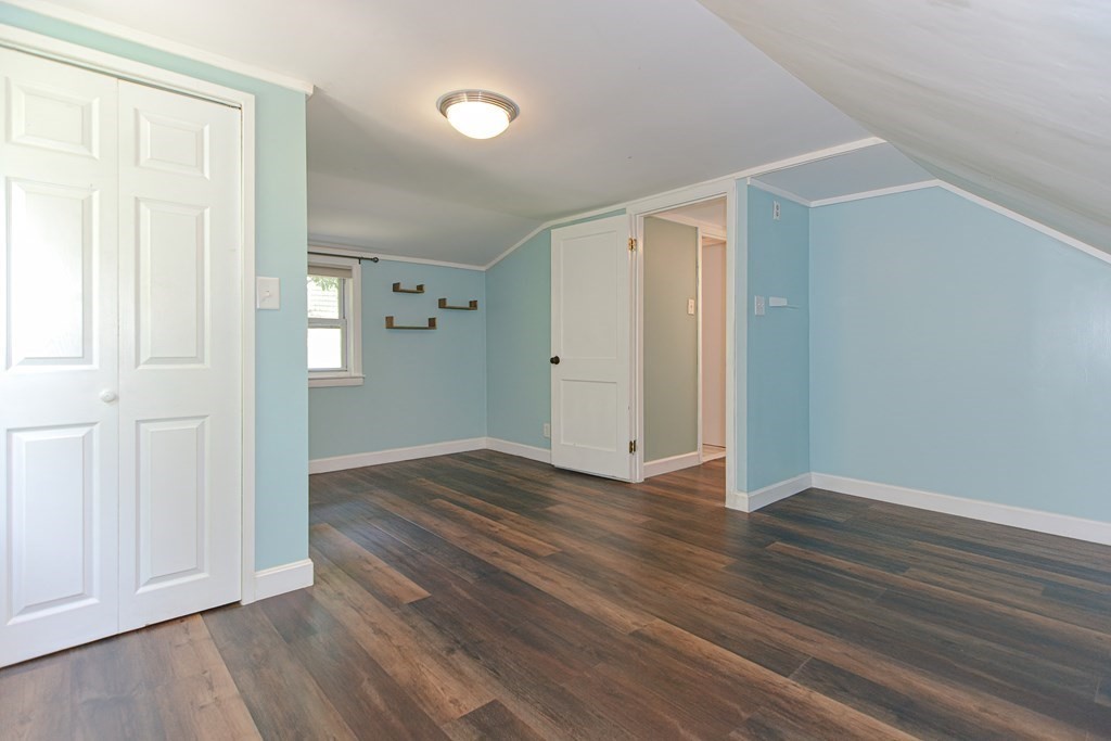 183 Brickel Road Stoughton, MA 02072 - Photo 20 of 38 a view of an empty room with wooden floor