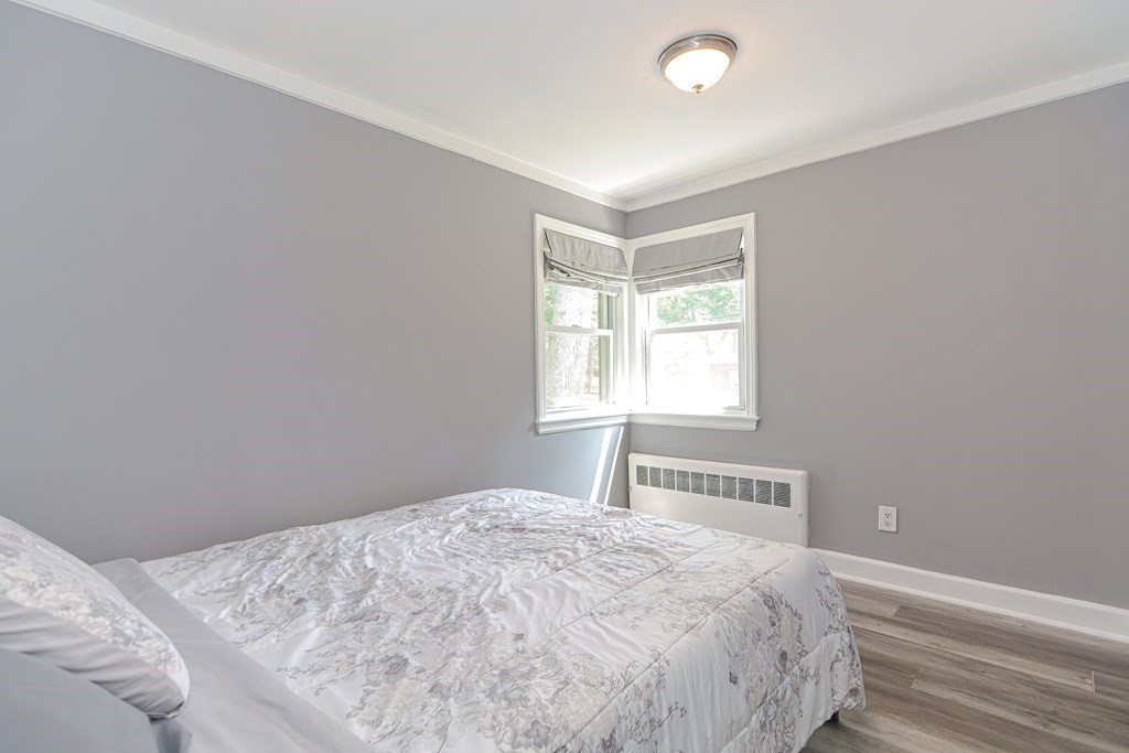 183 Brickel Road Stoughton, MA 02072 - Photo 24 of 38 a bedroom with a bed and a window