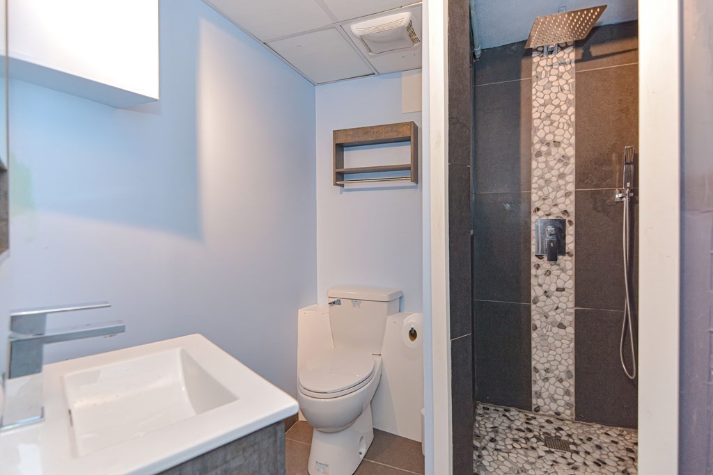 183 Brickel Road Stoughton, MA 02072 - Photo 31 of 38 a bathroom with a toilet and a sink