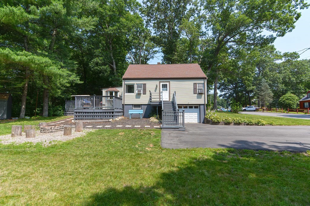 183 Brickel Road Stoughton, MA 02072 - Photo 32 of 38 a view of a house with a yard patio and a small yard