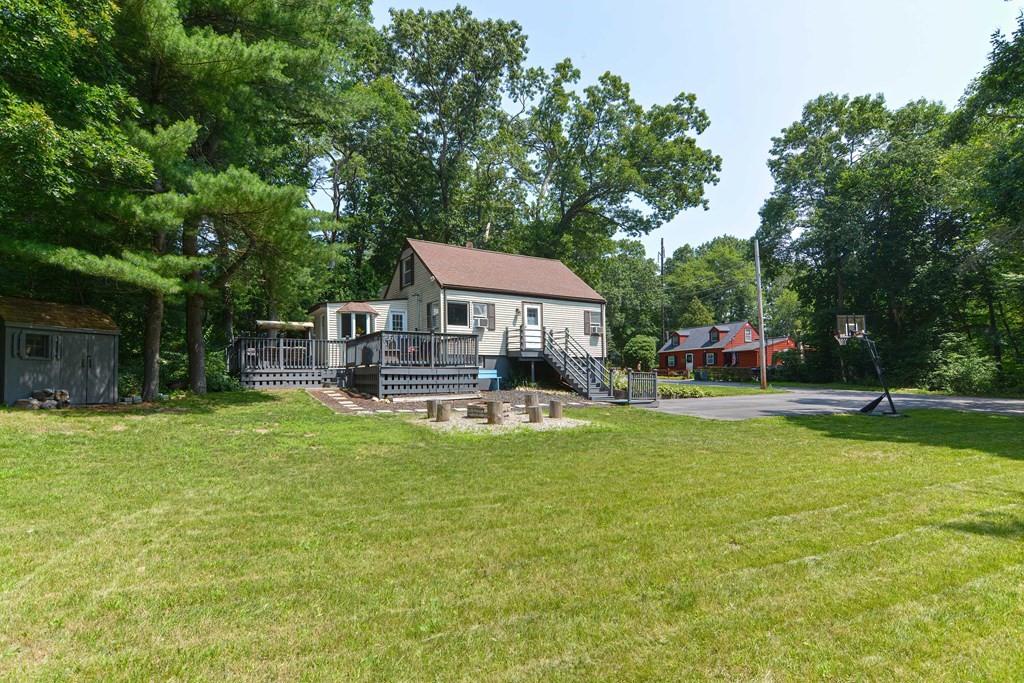 183 Brickel Road Stoughton, MA 02072 - Photo 33 of 38 a view of a house with swimming pool and sitting area